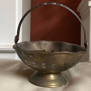 Vintage small brass footed bowl with a hinged handle